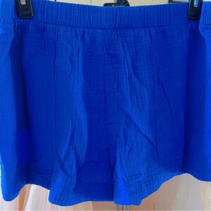 Women’s Royal Blue high-rise pull-on shorts with deep side pockets and side slit